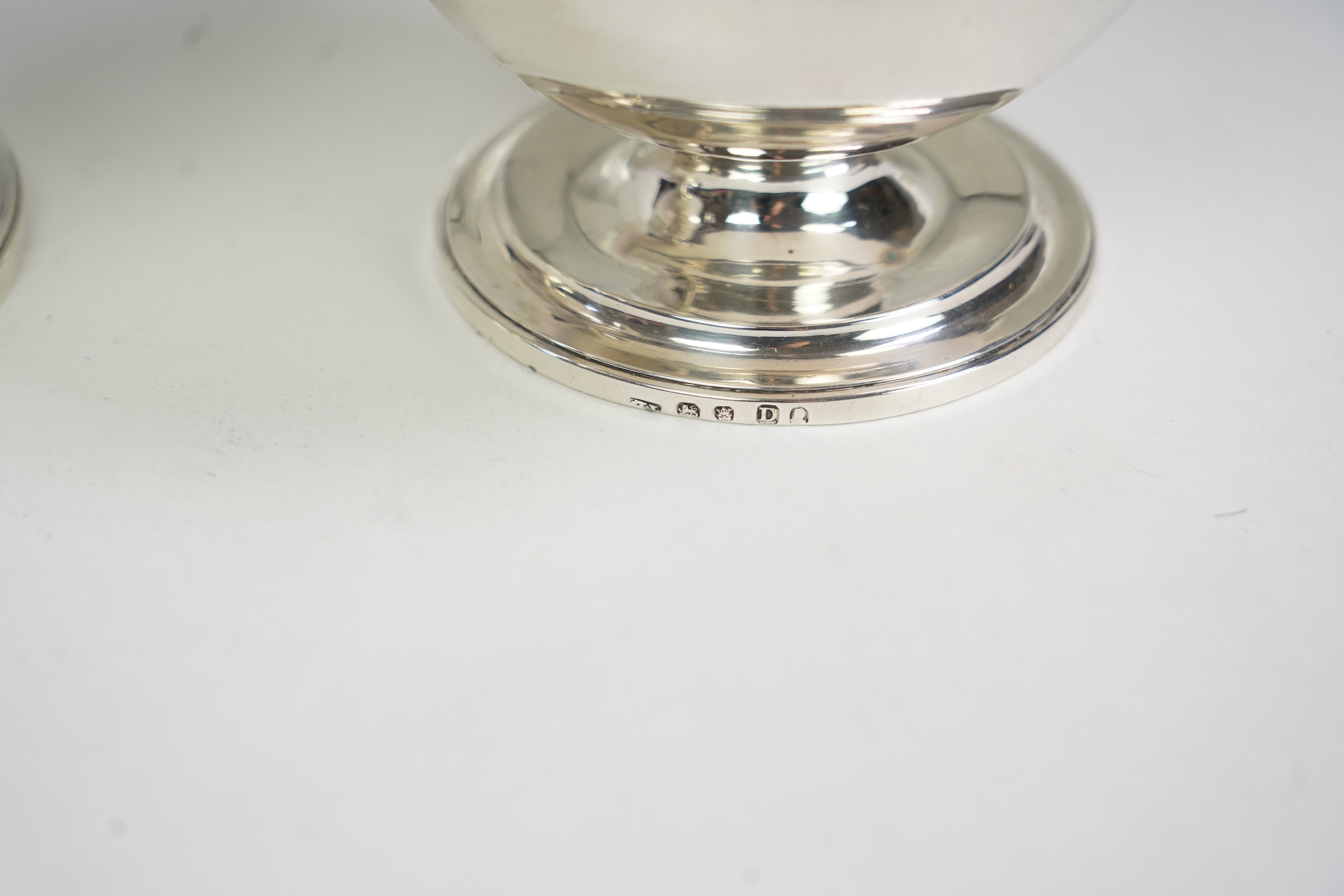 Two George III graduated silver pedestal sugar baskets, by James Darquits